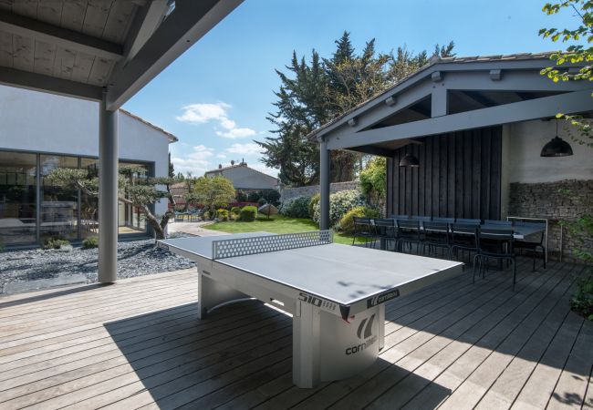 view on the garden, the terrace with ping pong table