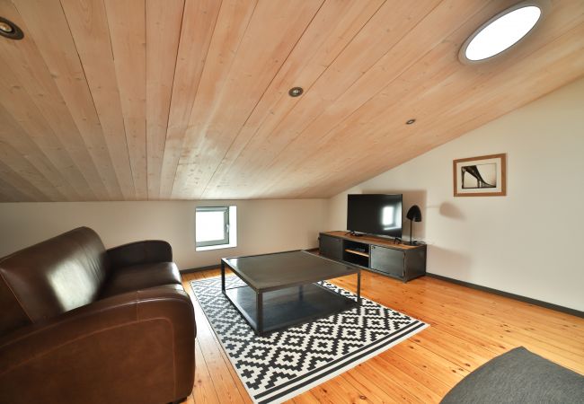 Living room with leather sofas, wooden floor and coffee table 