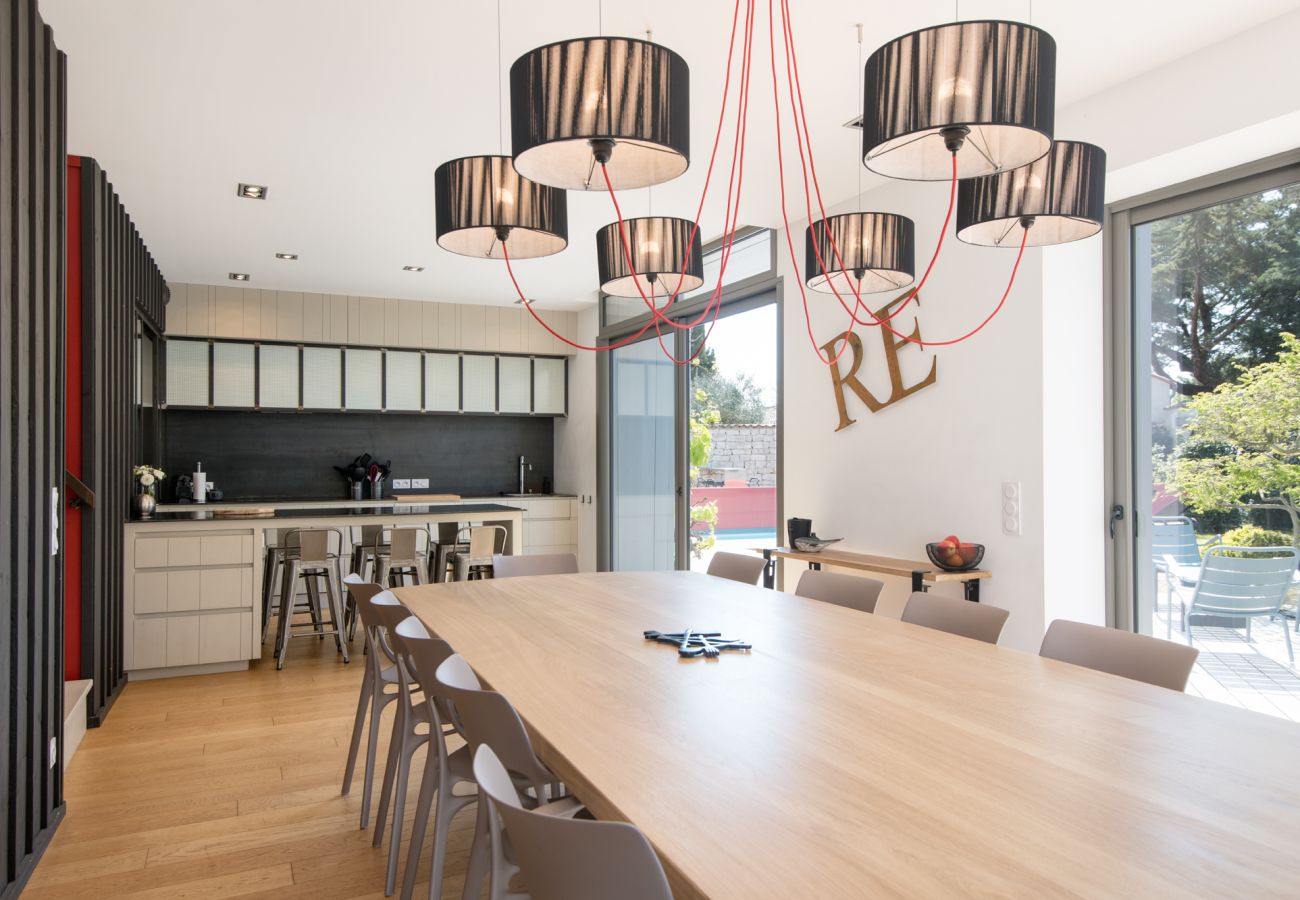 Kitchen and dining room with large table and chairs 