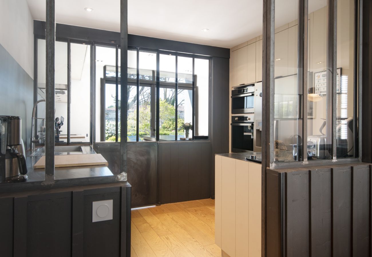 Bright, fully equipped kitchen with wooden floor