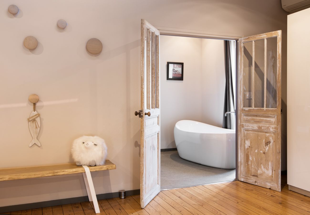 Bathroom with large modern bath