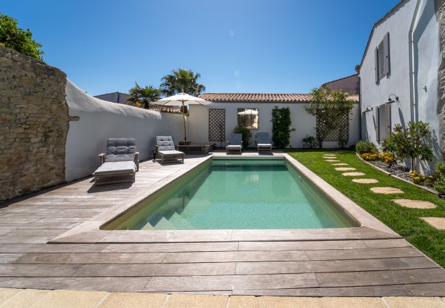 Pool view with garden and sun lounger