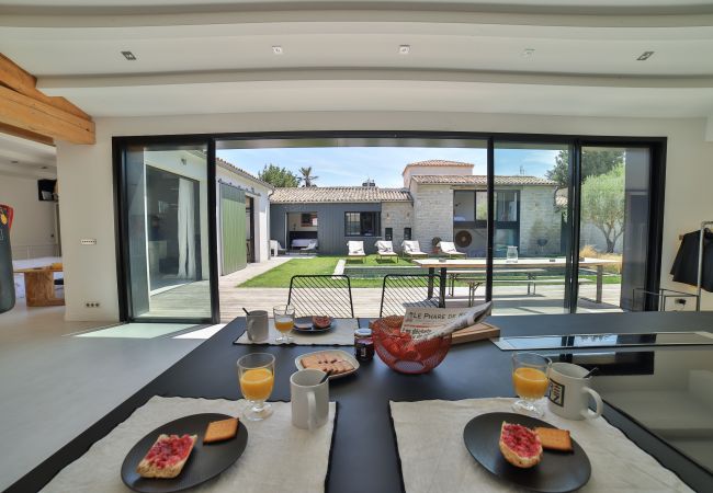 Breakfast at the kitchen table overlooking the garden and pool 