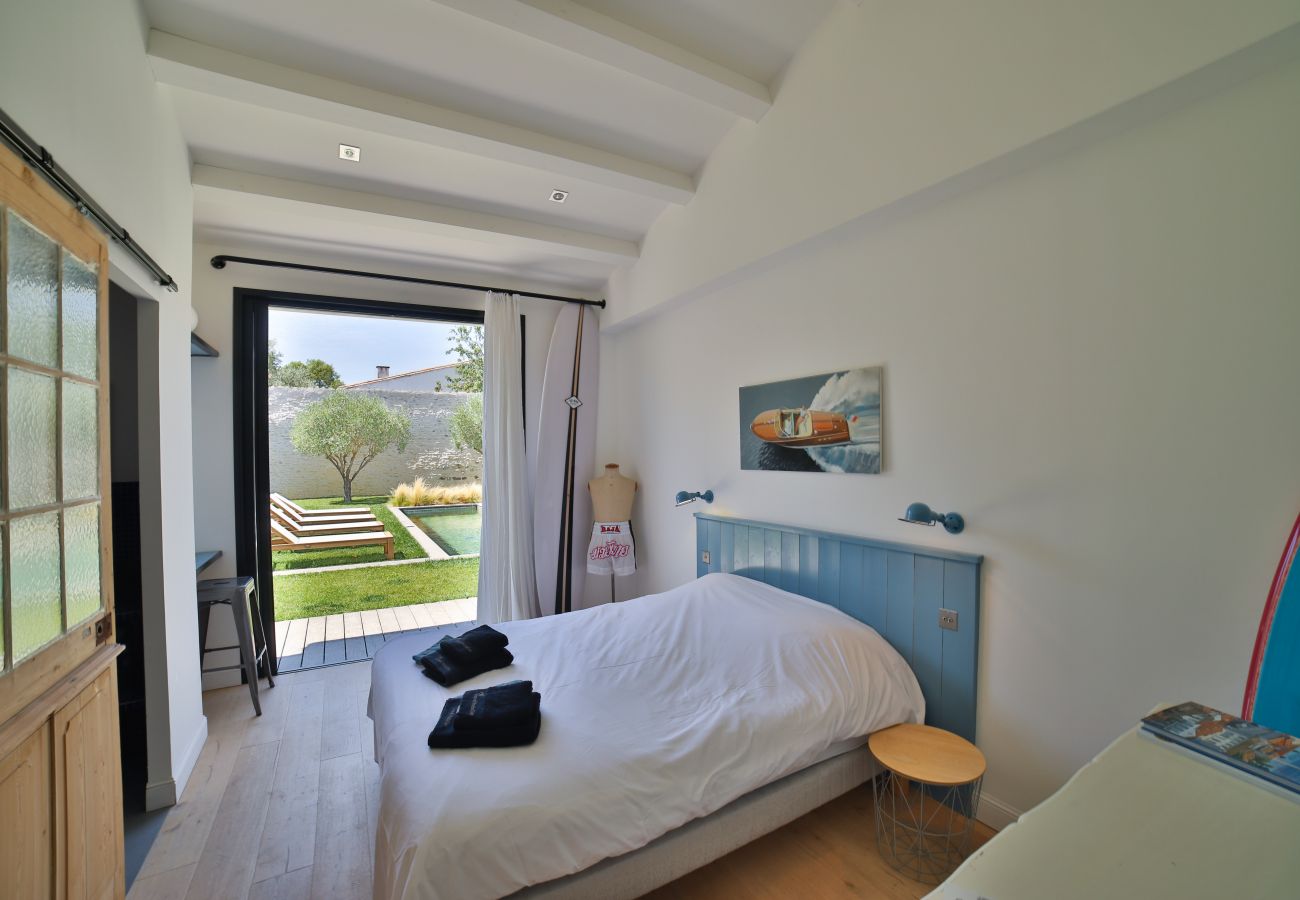 Master bedroom with access to garden and pool 