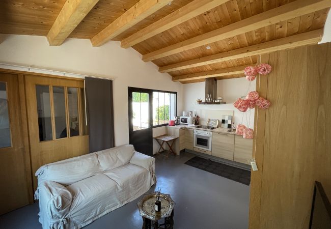 The living room of the outbuilding with sofa and kitchen 