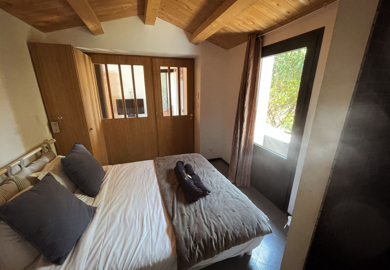 The third bedroom with double bed and large window 
