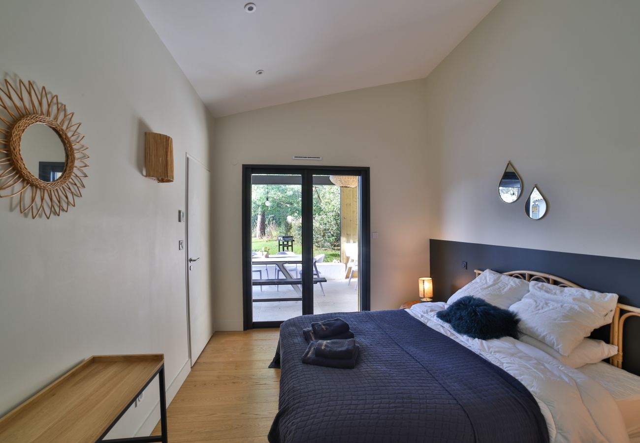 Bedroom with kingsize bed and wooden floor