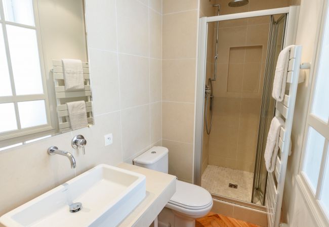 Bathroom with shower, basin and toilet 
