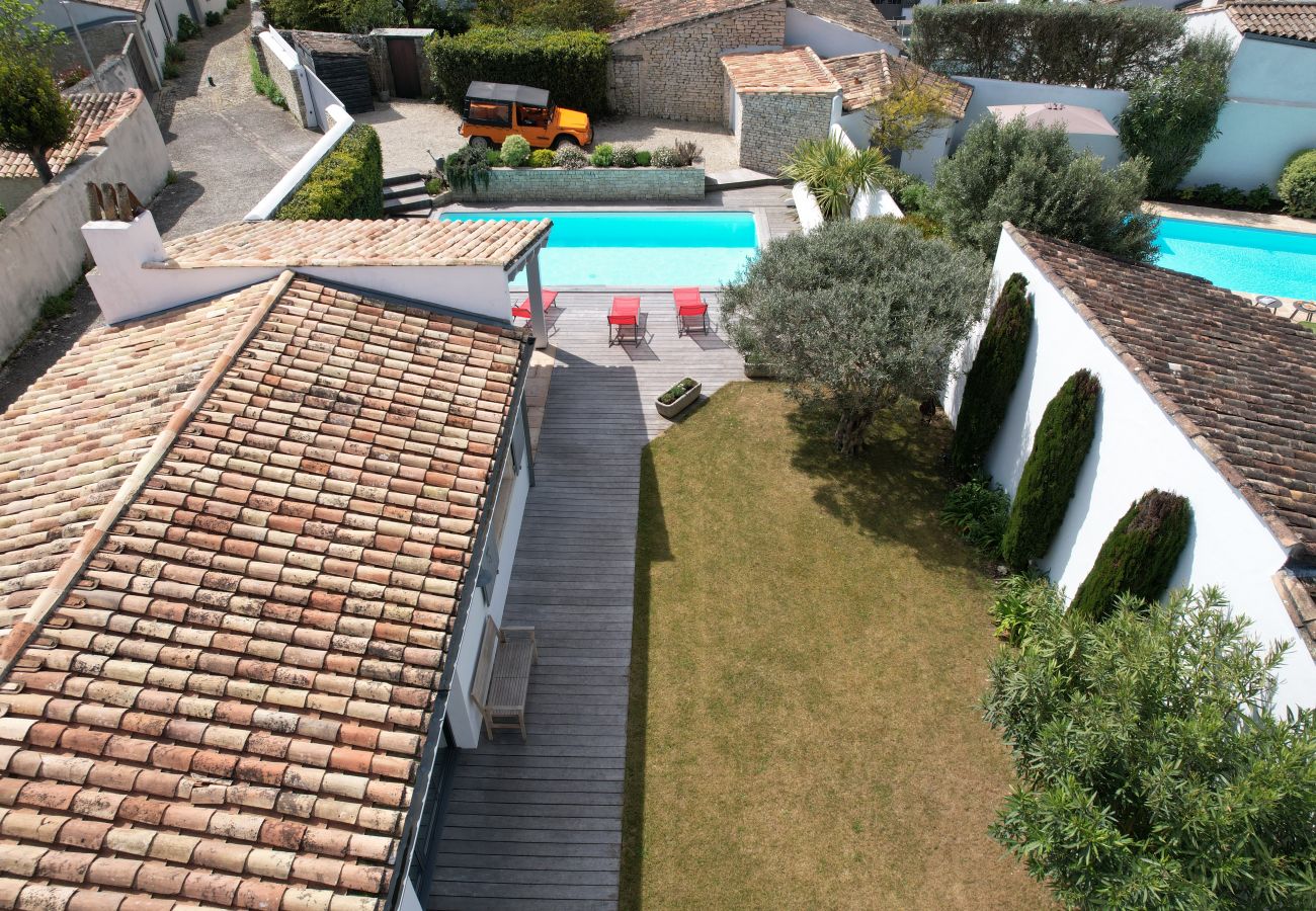 Aerial view of the house, pool and garden