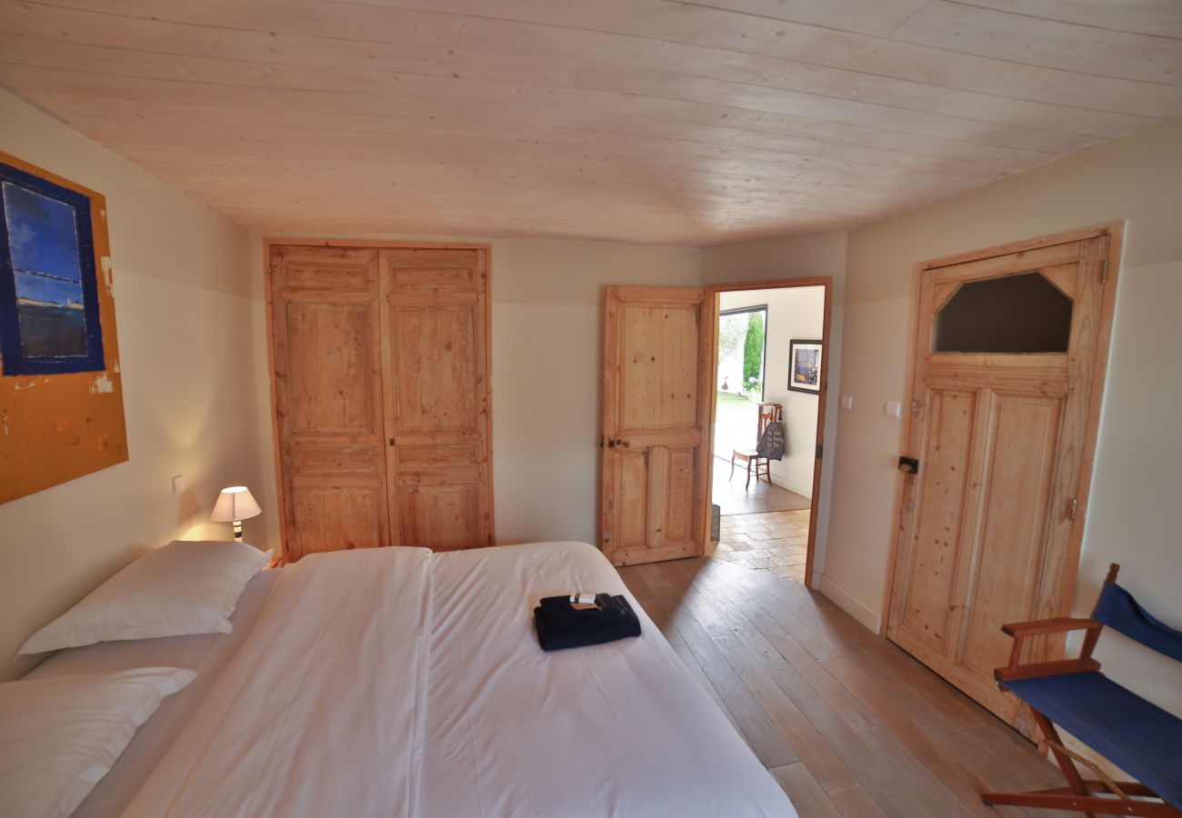 Master bedroom with kingsize bed, wooden floor and dressing room