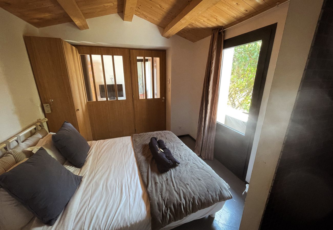 Master bedroom with double bed and pool view