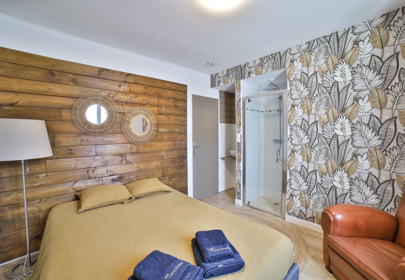Bedroom with double bed and bathroom