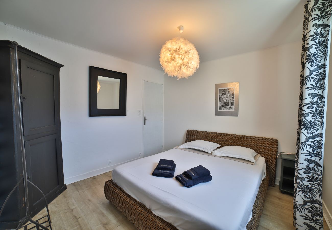 Bedroom with double bed and large wardrobe