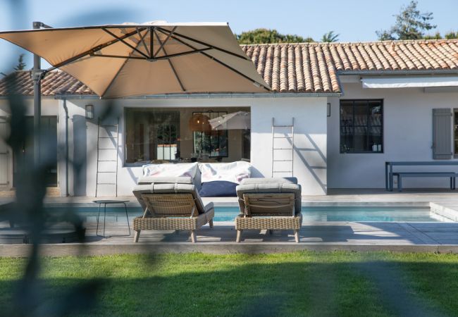 View on the garden, the pool and the house 