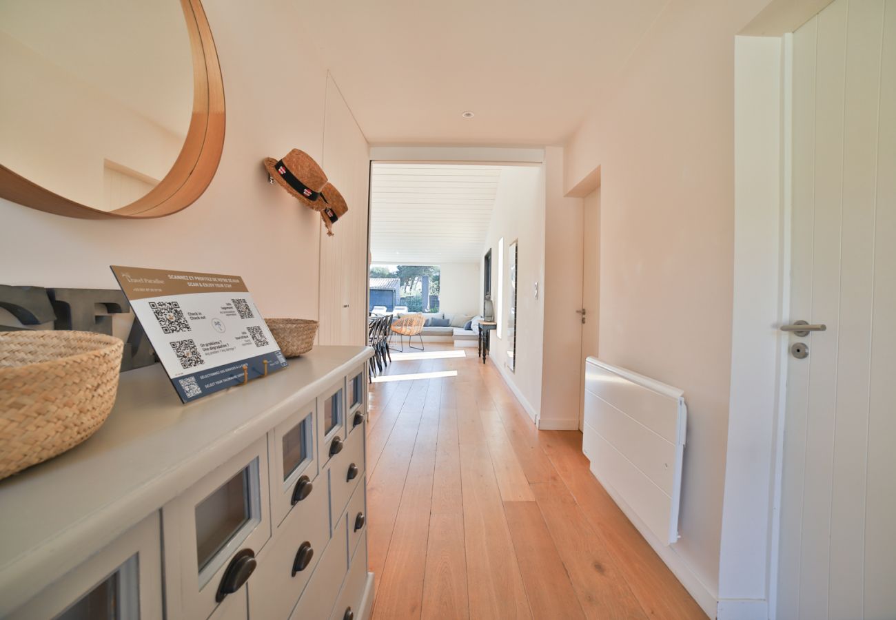 Corridor with parquet floor and large chest of drawers 