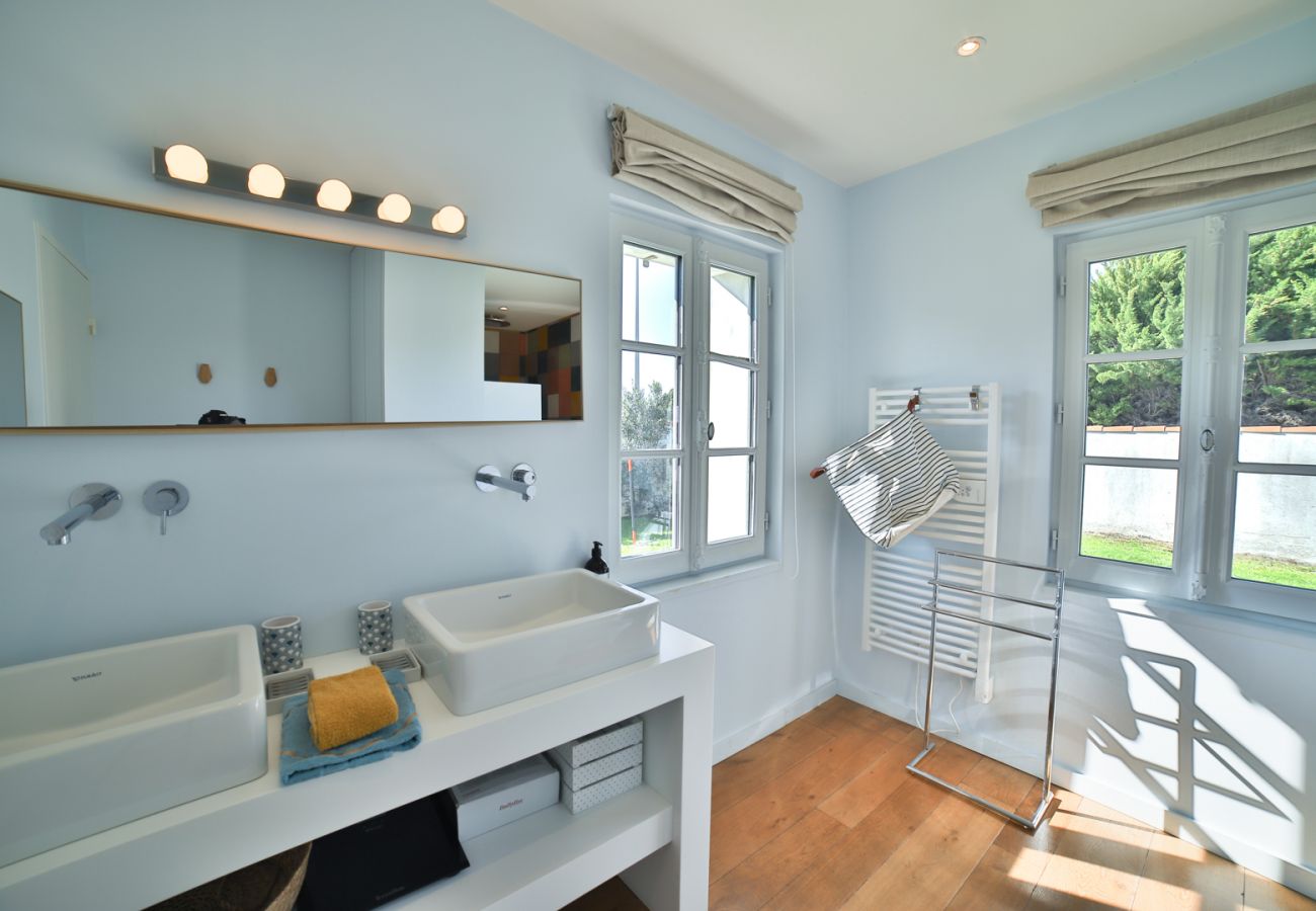 Bathroom with two basins and shower 