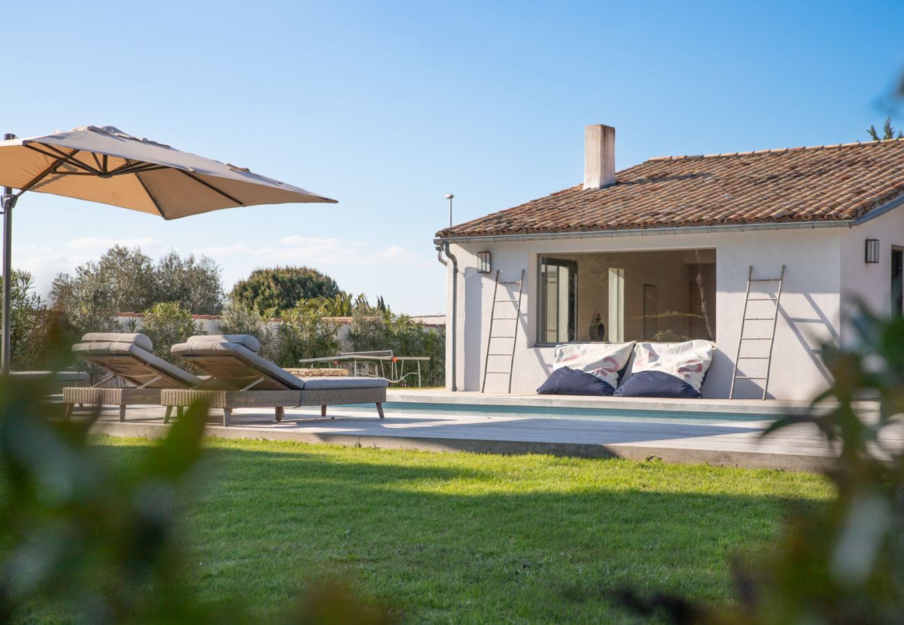 View on the garden, the pool and the house 