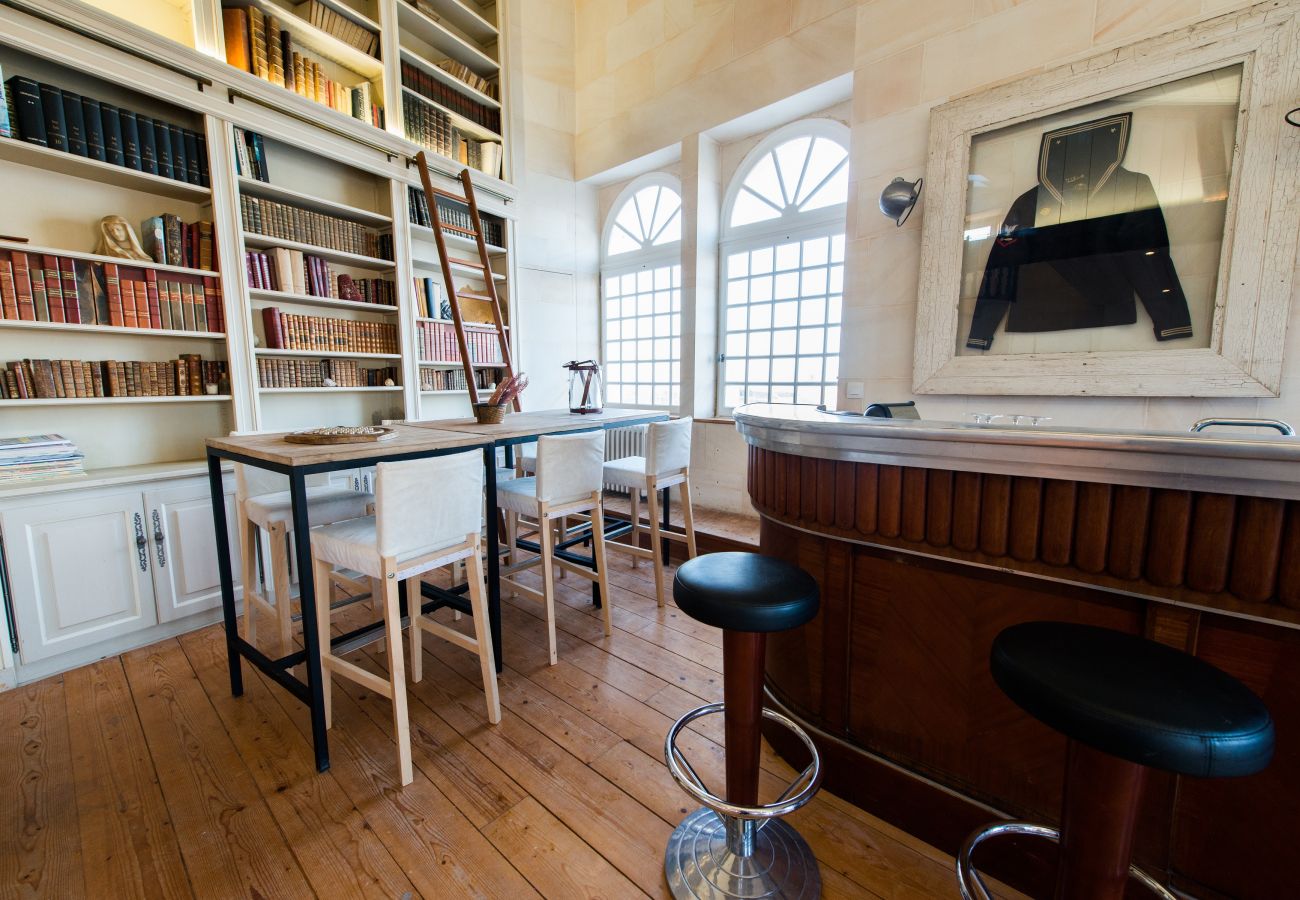 The library with large shelves full of old books