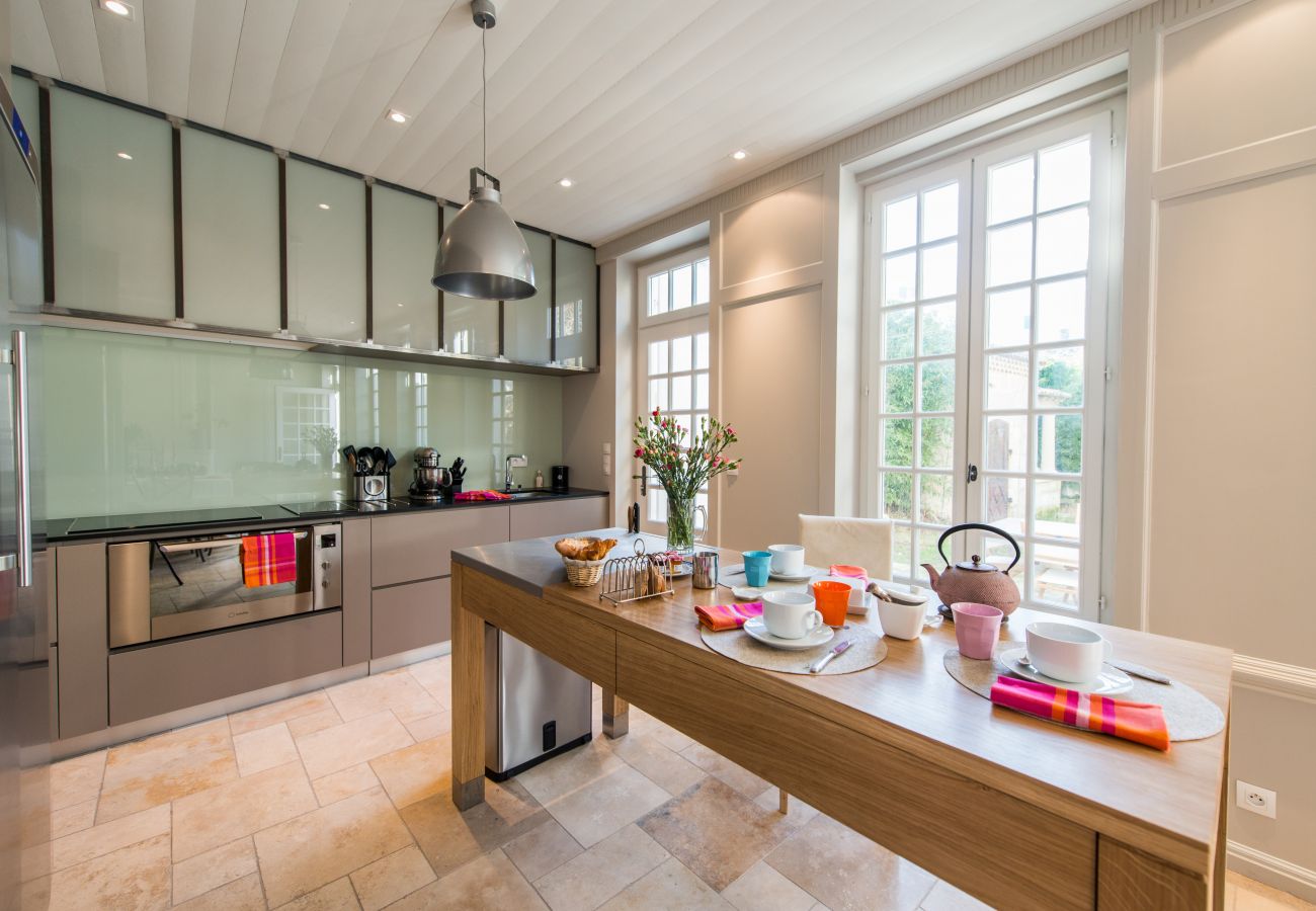 The bright, fully equipped kitchen 
